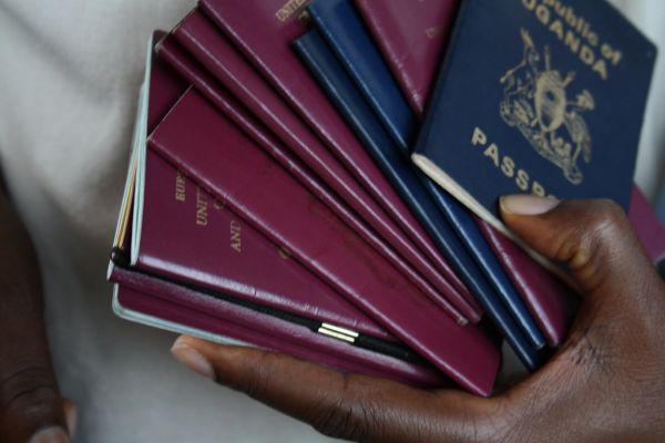 Photograph of hand holding passports