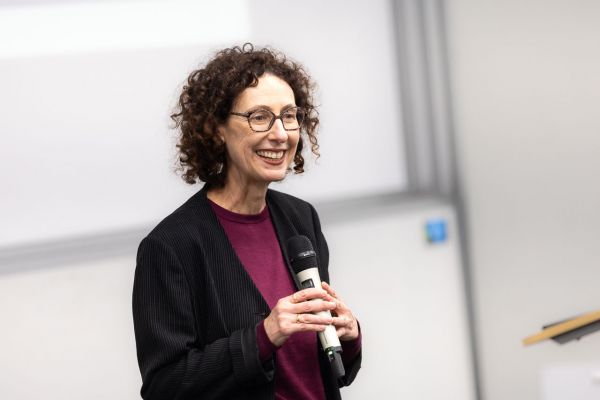 Jennifer Balint speaking into a microphone