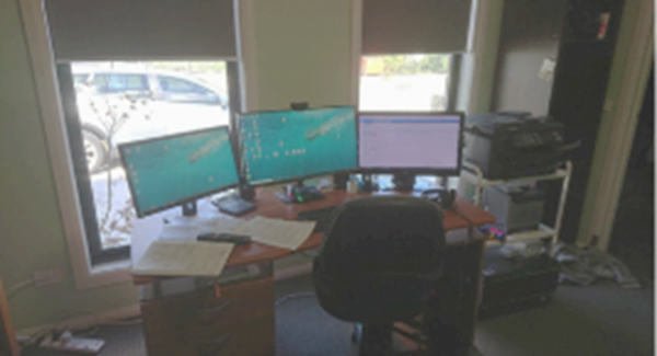 A patient home office for video telehealth consultations showing how easy it is to dial in with the computer setup so close to the bed.