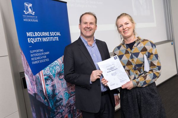 Mark Cassidy presents a certificate to Penne Thornton