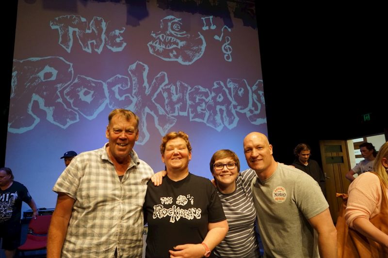 Four people smiling at the camera